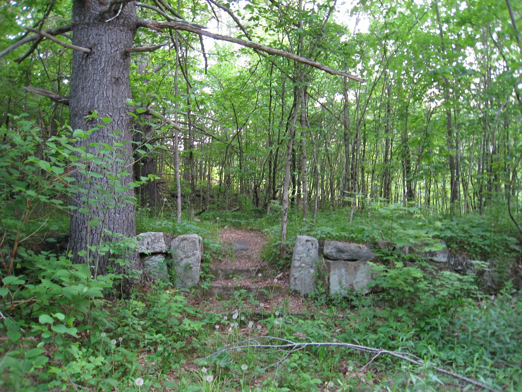 Old Hill Village - South End 485.jpg - In February 1937, residents of Hill Village NH learned that their village, near the Pemigewasset River, was to become a flood control reservoir for the Franklin Falls dam project. To accommodate the construction of the Franklin Falls Dam, the village of Hill NH was to be relocated. By January of 1940, the citizens of Hill NH formed an association, purchased land, and began planning a new model village with the help of the NH State Planning and Development Commission. Construction started in 1940, and by June of 1941 the new town hall and school were completed, along with the streets, water system, and 30 houses. The 1941 town meeting was called to order in the old town hall, recessed, and reconvened in the new village.